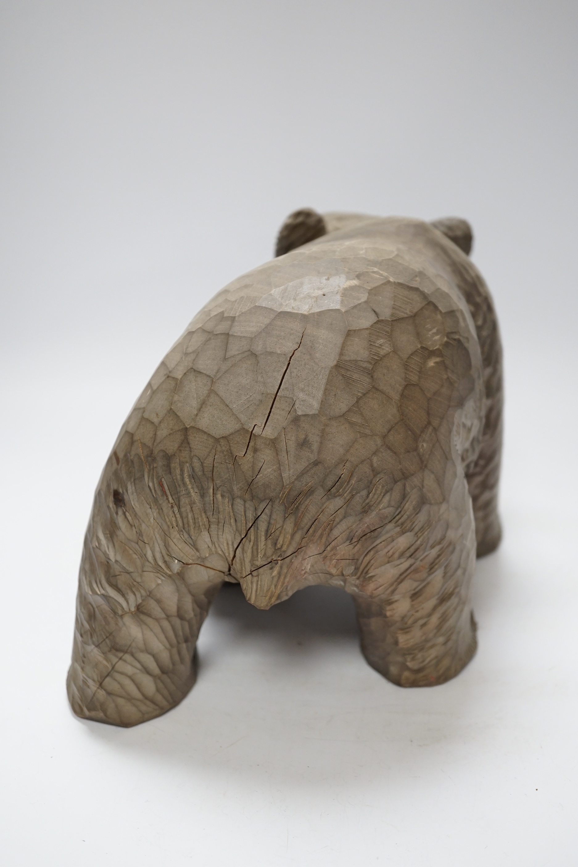 A Japanese carved wood bear, 32cm long